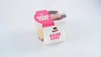Halva cake with rose in a plastic container, white and pink packaging, on white background